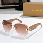 Bvlgari sunglasses with pink gradient lenses, tortoiseshell frame, and gold details.