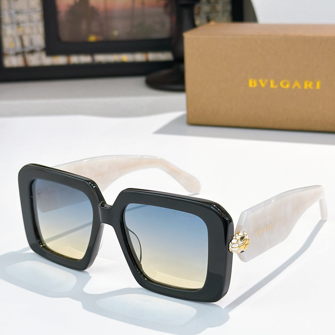 Square sunglasses, dark frames with blue gradient lenses, gold logo on temples