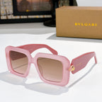 Square sunglasses, pink frames with light pink lenses, gold logo on temples