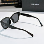 Prada sunglasses, black frame with dark tinted lenses, side view
