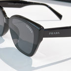 Prada sunglasses, black thick frame with dark lens and side temple