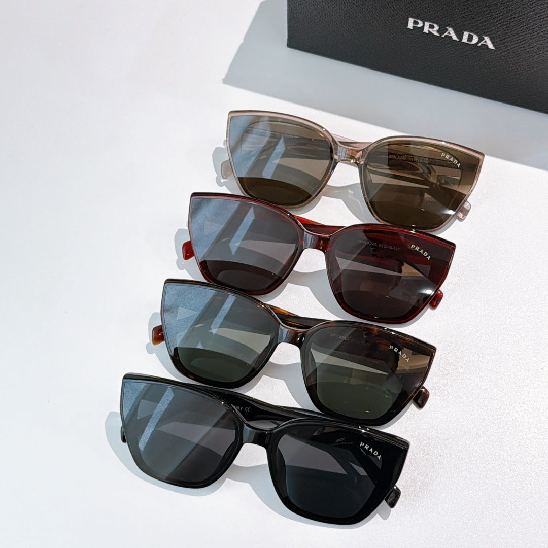 Stacked Prada sunglasses, mixed frames with tinted lenses