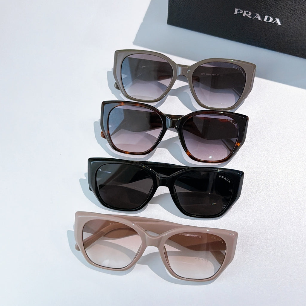 Prada set of four cat-eye sunglasses with assorted frame and lens colors