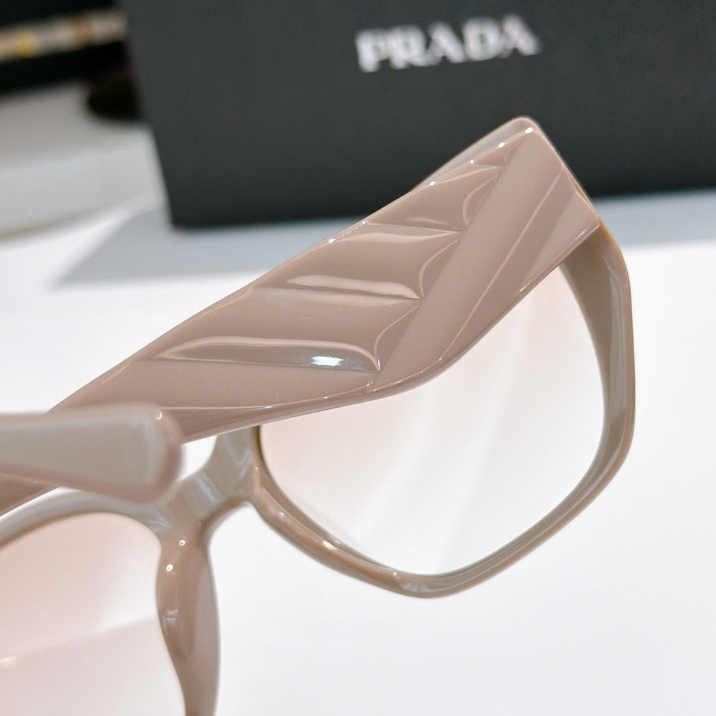 Prada light pink cat-eye sunglasses close-up of frame and temple