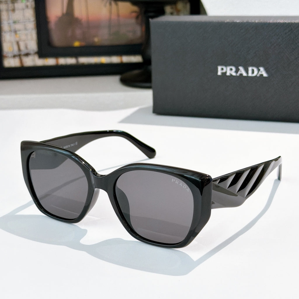 Prada cat-eye sunglasses with dark lenses and black frames
