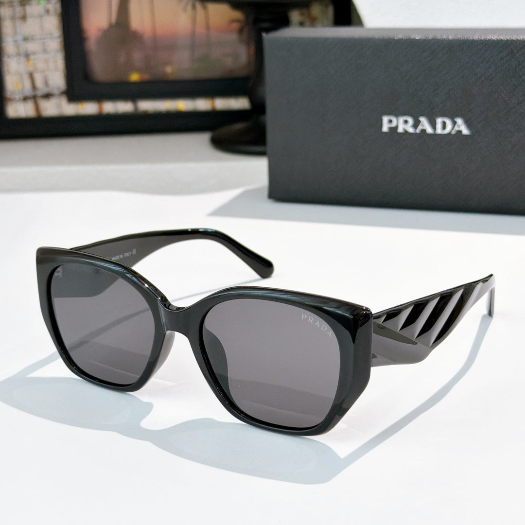 Prada cat-eye sunglasses with dark lenses and black frames