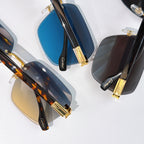 Designer sunglasses close-up set: blue and dark lenses with tortoiseshell and black frames, gold details