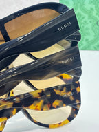 Gucci sunglasses side view with dark navy temple, tortoiseshell pattern, Gucci logo