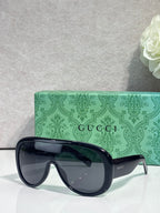 Gucci dark blue oversized sunglasses with black lenses and tortoiseshell temples