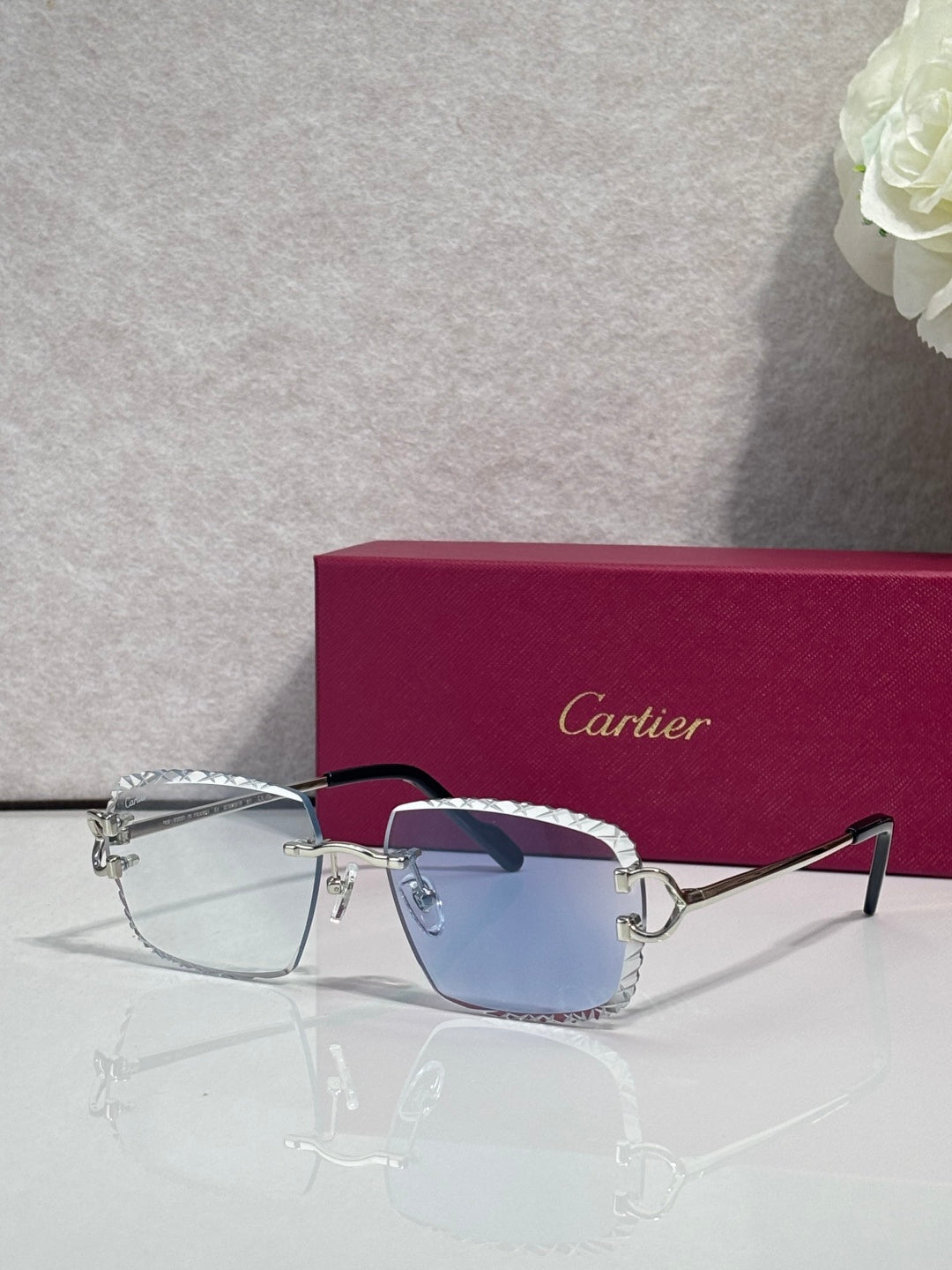 Eyeglasses with clear lenses, silver metal rectangular frame, dark arms