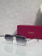 Cartier glasses with gold frame, dark lenses, and dark side arms with hinge details