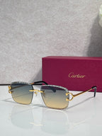 Cartier glasses with gold frame, amber lenses, and dark side arms with decorative trim
