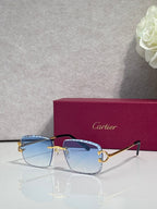 Cartier glasses with gold frame, blue tinted lenses, and dark side arms