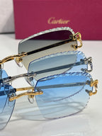 Cartier glasses close-up with gold hinges and blue tinted rectangular lenses