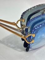 Cartier glasses side view with blue tinted lenses and gold metal temple frames