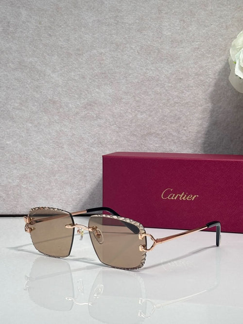Cartier glasses with gold frame, light tan lenses, and dark side arms