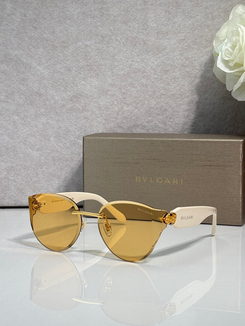 Bvlgari sunglasses with gold-tone frame and amber gradient lenses, white temples