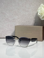 Bvlgari sunglasses with black frame and dark gradient lenses, gold hinge details