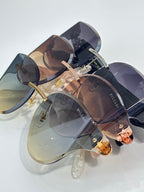 Bvlgari sunglasses in mixed frames with dark and amber gradient lenses