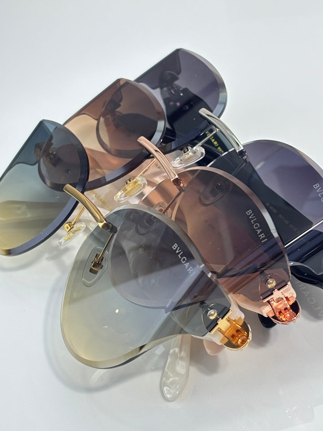Bvlgari sunglasses in mixed frames with dark and amber gradient lenses