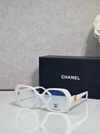 Eyeglasses with white frame, blue lenses, CHANEL logo on temple