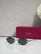 Cartier eyeglasses with silver-tone thin metal frame and black lenses