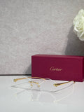 Cartier eyeglasses with gold-tone thin metal frame and clear lenses