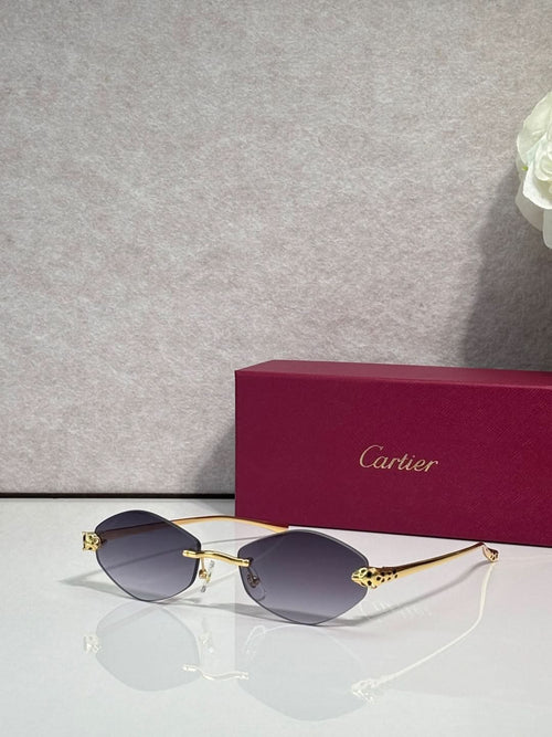 Cartier eyeglasses with gold-tone thin metal frame and dark blue lenses