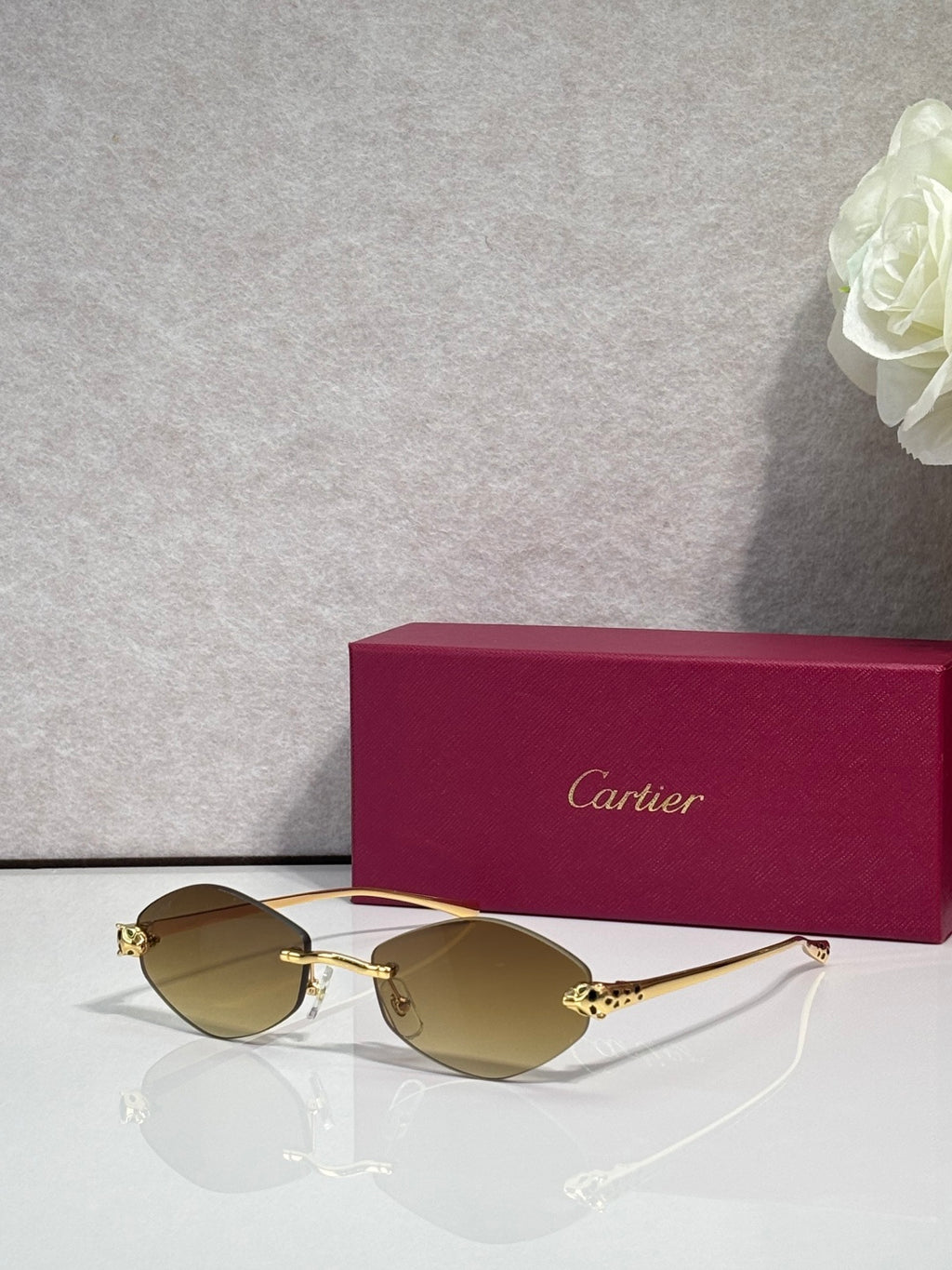 Cartier eyeglasses with gold-tone thin metal frame and amber lenses