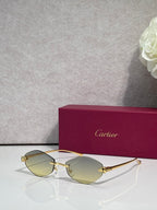 Cartier eyeglasses with gold-tone thin metal frame and light yellow lenses