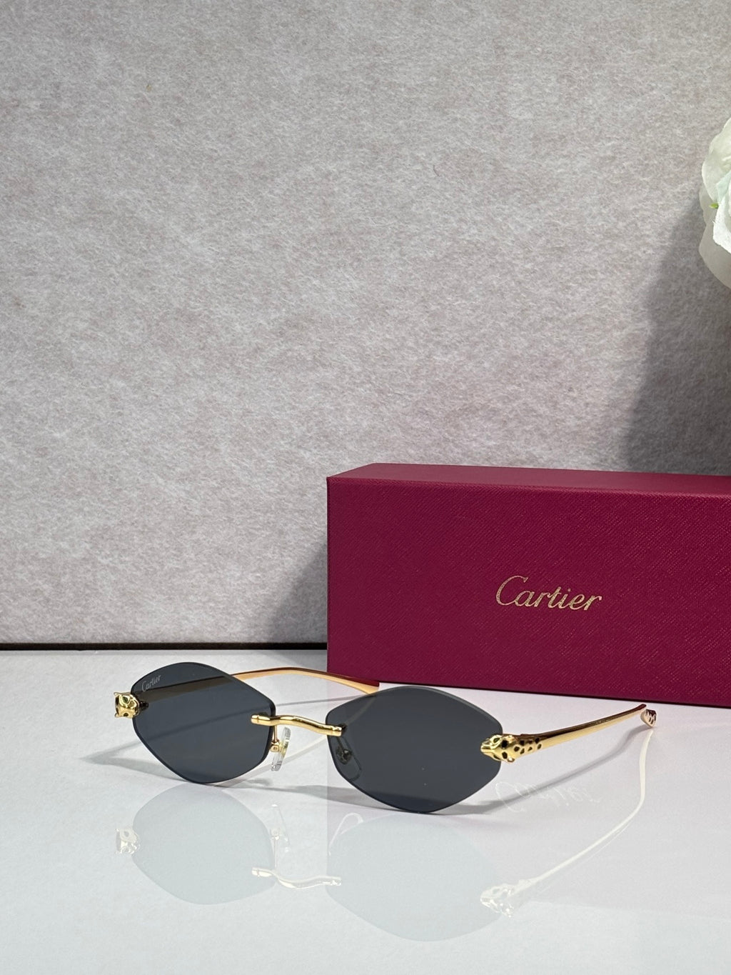 Cartier eyeglasses with gold-tone thin metal frame and dark lenses