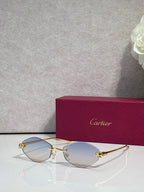 Cartier eyeglasses with gold-tone thin metal frame and light blue lenses