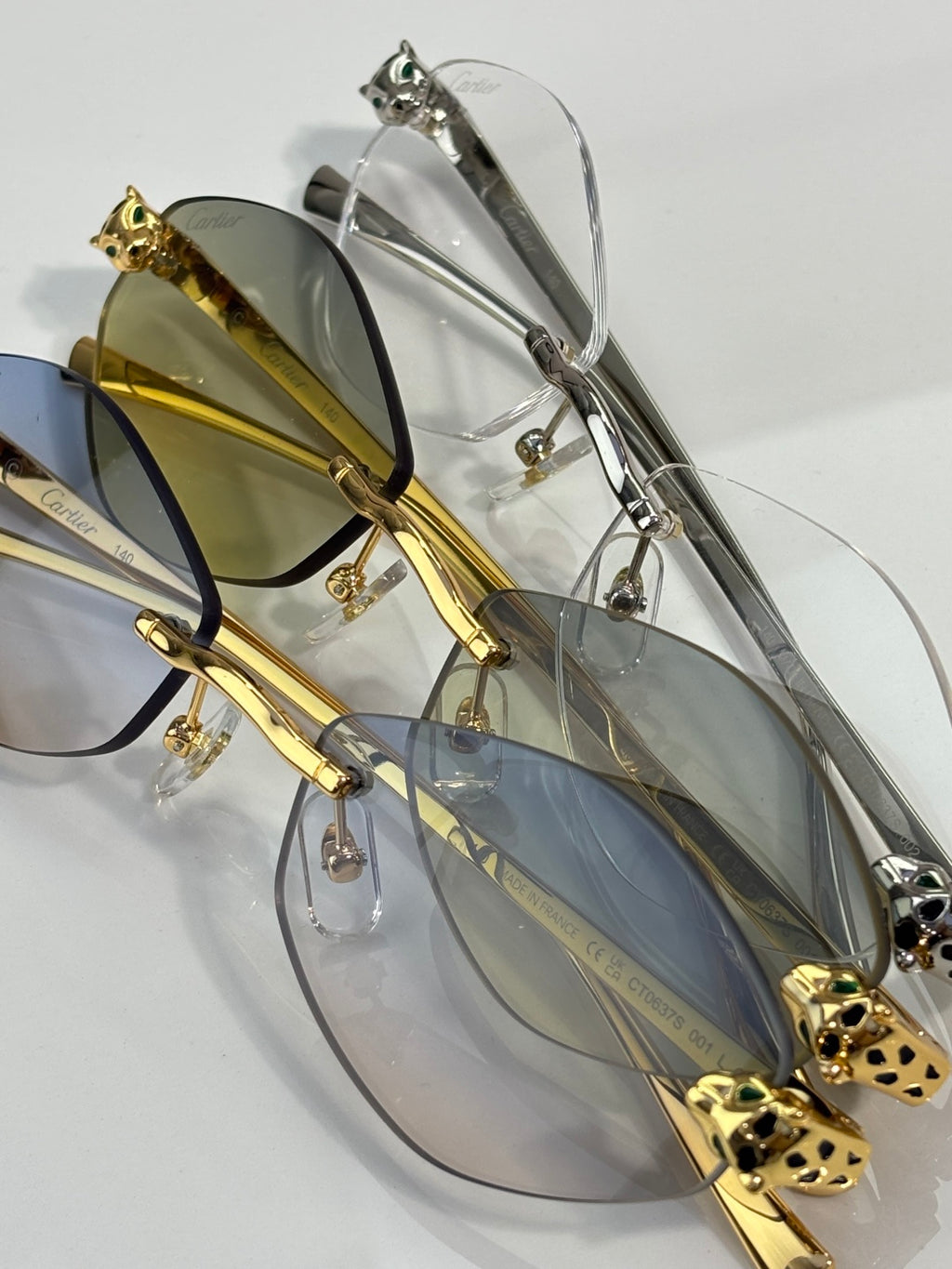 Cartier eyeglasses with gold and silver-tone frames and tinted lenses