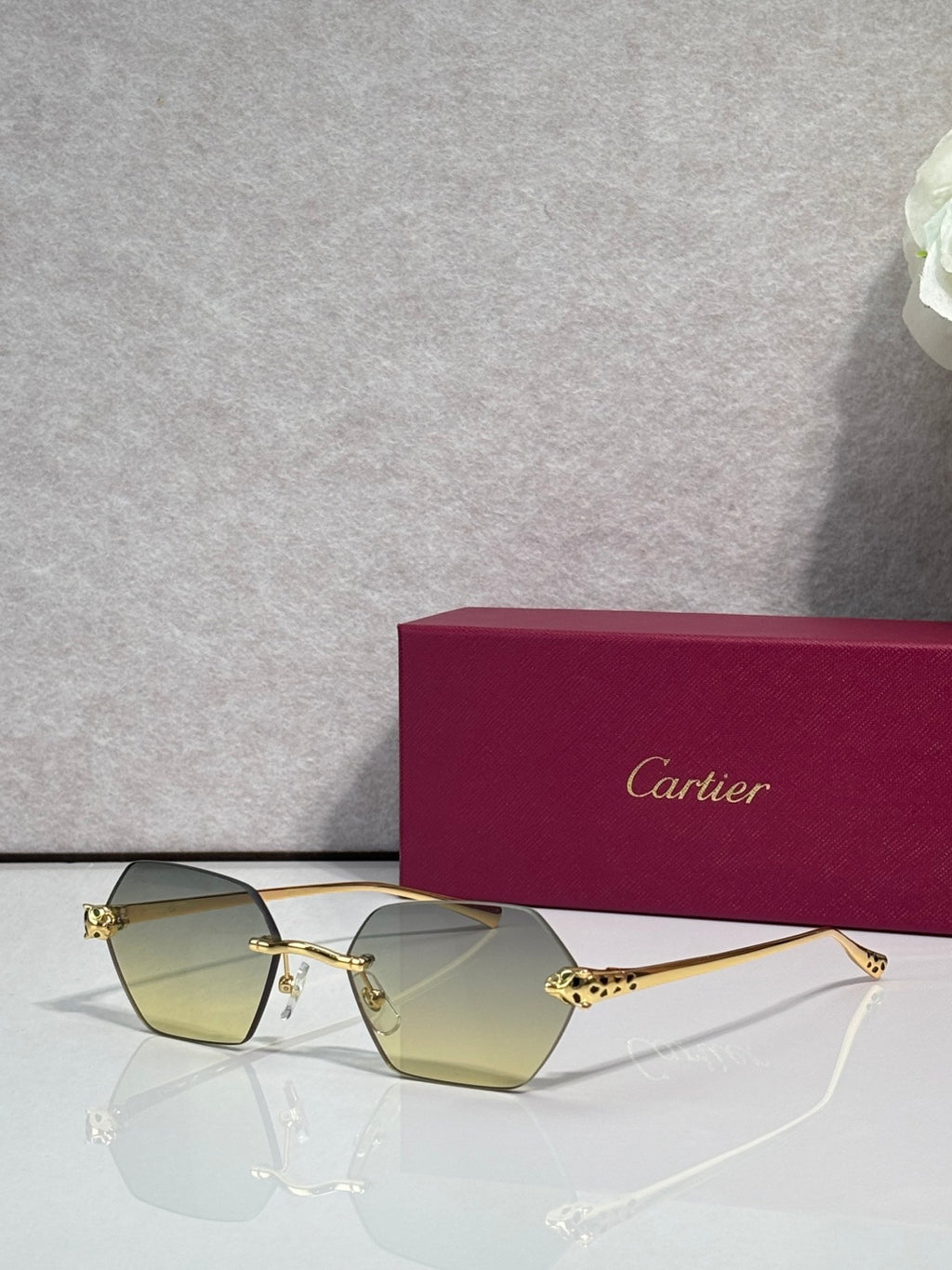 Cartier sunglasses with gold frame and yellow-tinted lenses