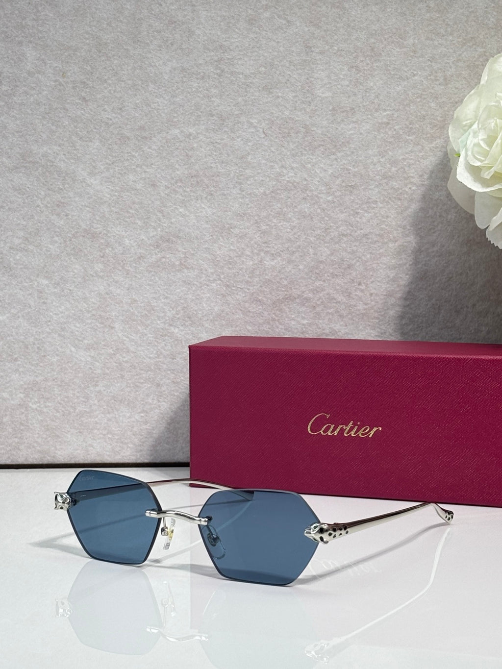 Cartier sunglasses with gold frame and blue-tinted lenses