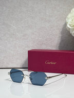 Cartier sunglasses with gold frame and blue-tinted lenses