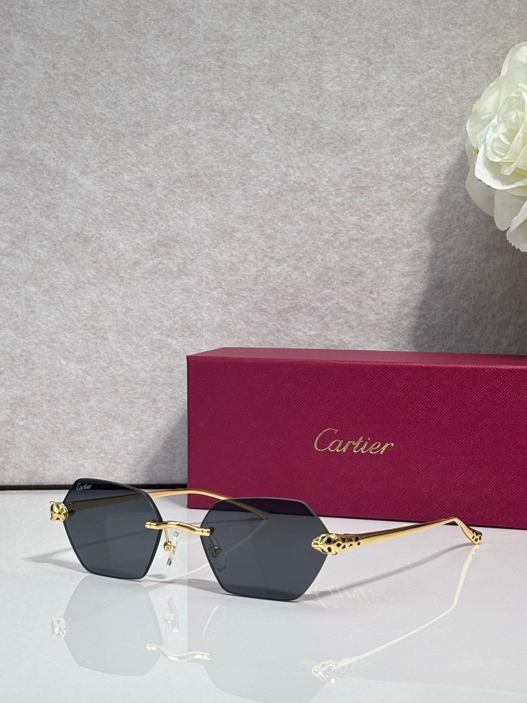Cartier sunglasses with gold frame and black-tinted lenses