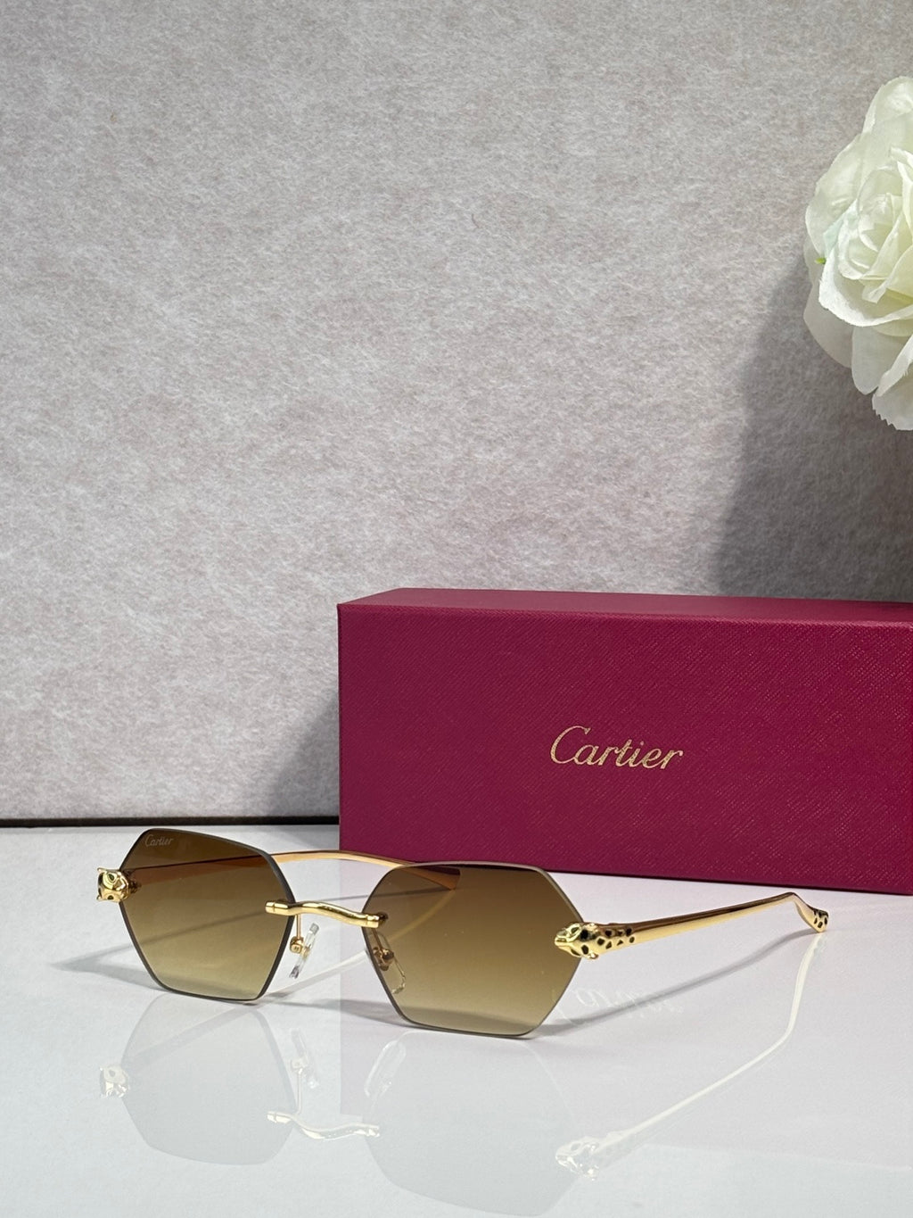 Cartier sunglasses with gold frame and light brown-tinted lenses