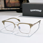 Square eyeglasses with clear lenses, chrome frame, and gold patterned temple details