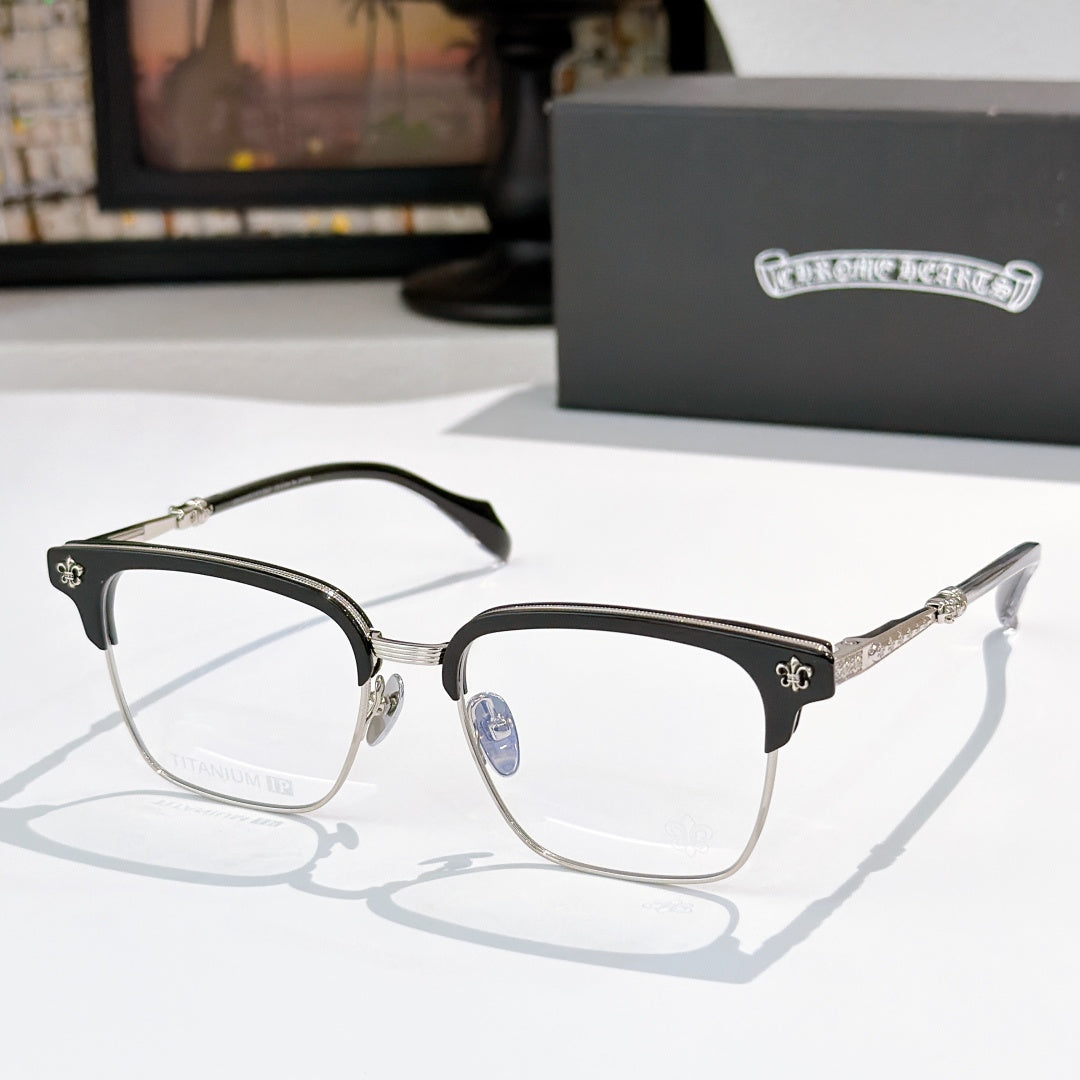 Square eyeglasses with clear lenses, black frame, and gold-and-green patterned temples