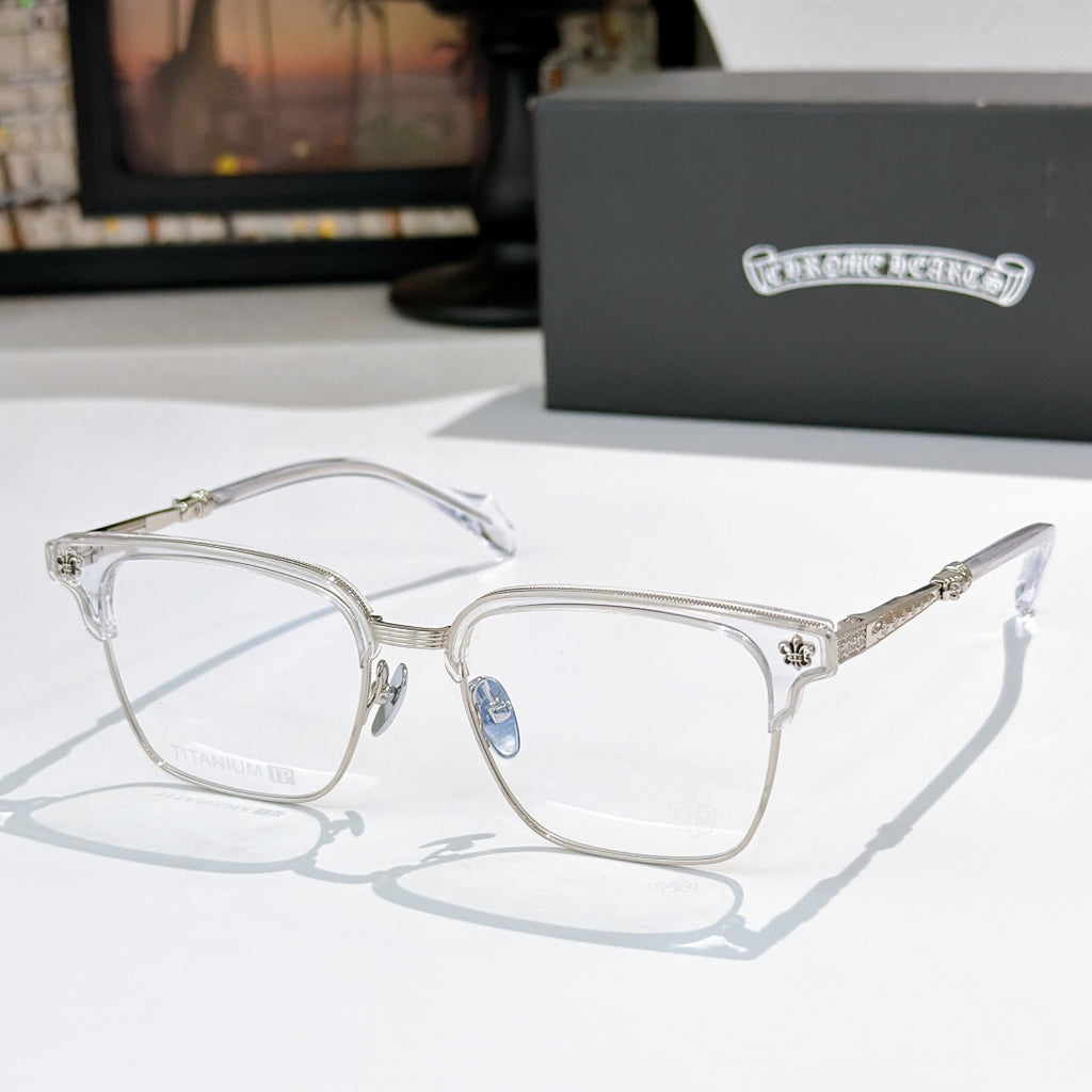 Square eyeglasses with clear lenses, chrome frame, and gold engraved temple details