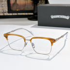Square eyeglasses with clear lenses, gold frame, and patterned temples with engraved details
