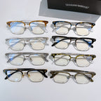 Assorted eyeglasses with clear lenses and mixed frame colors, arranged in rows