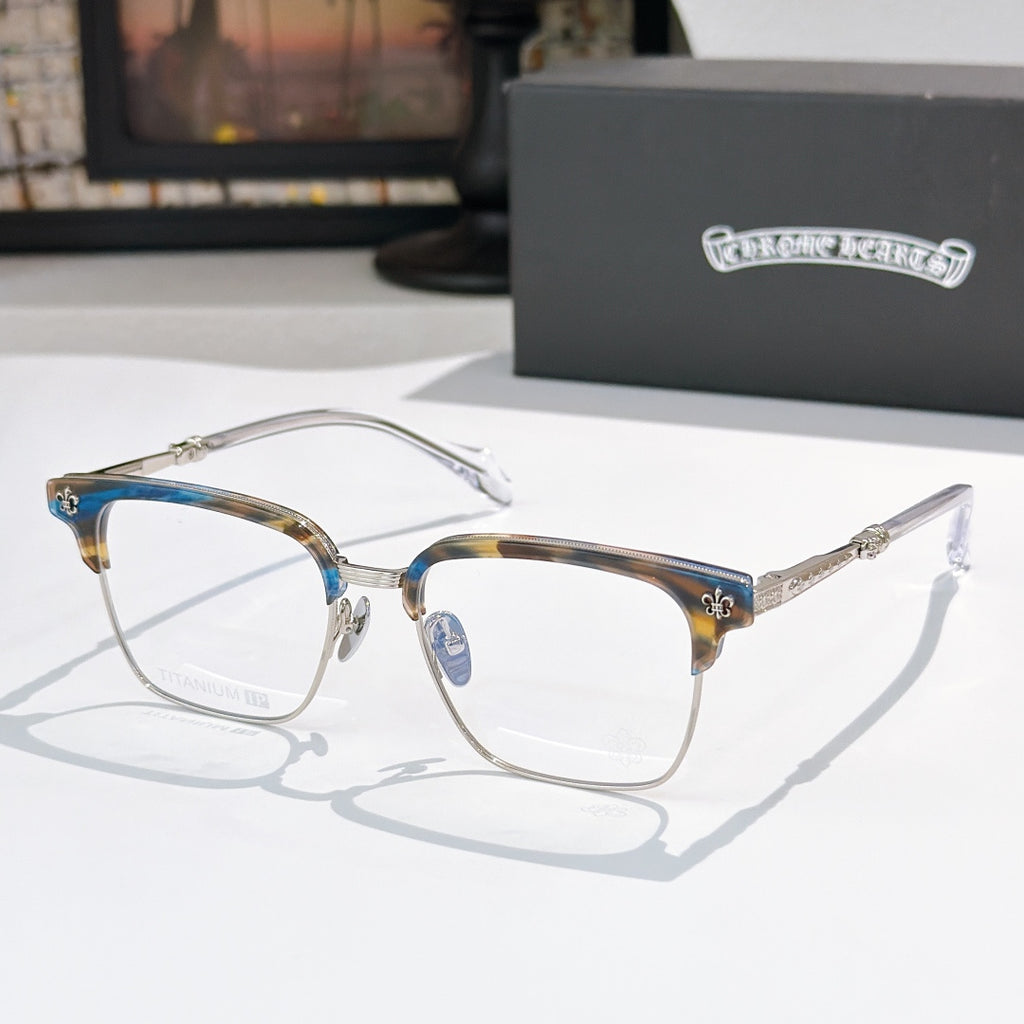 Square eyeglasses with clear lenses, chrome frame, and gold-and-green patterned temples