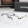 Black metal eyeglass frames with clear lenses and ornate temple detailing