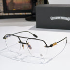 Black metal eyeglass frames with clear lenses and ornate temple detailing