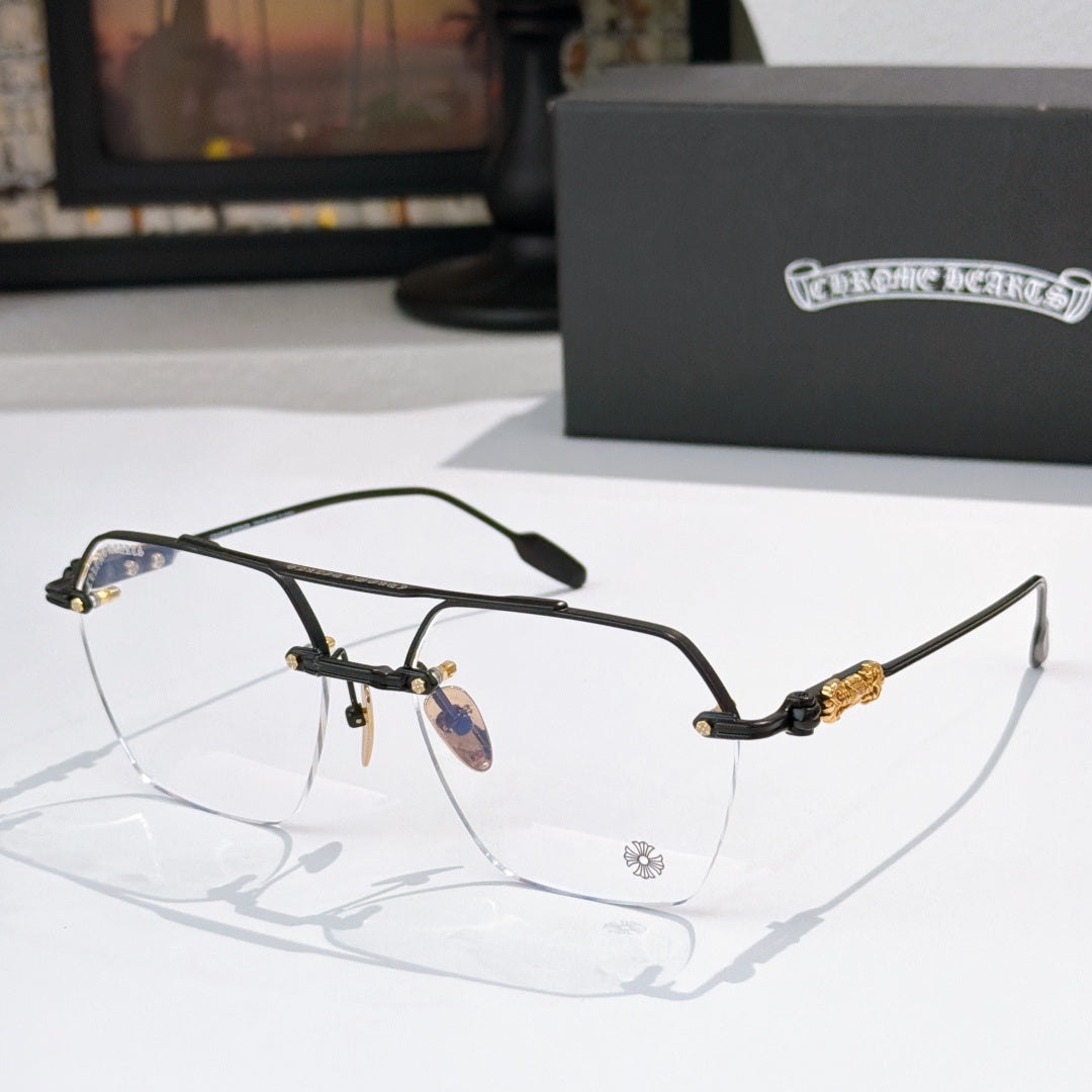 Black metal eyeglass frames with clear lenses and ornate temple detailing