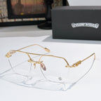 Gold metal eyeglass frames with clear lenses and ornate temple embellishments