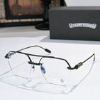 Black metal eyeglass frames with clear lenses and patterned temple details