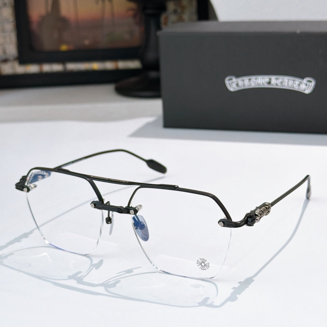 Black metal eyeglass frames with clear lenses and patterned temple details